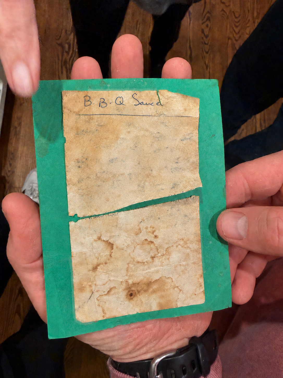 Sam’s weathered handwritten barbecue sauce recipe card with the quantities obscured