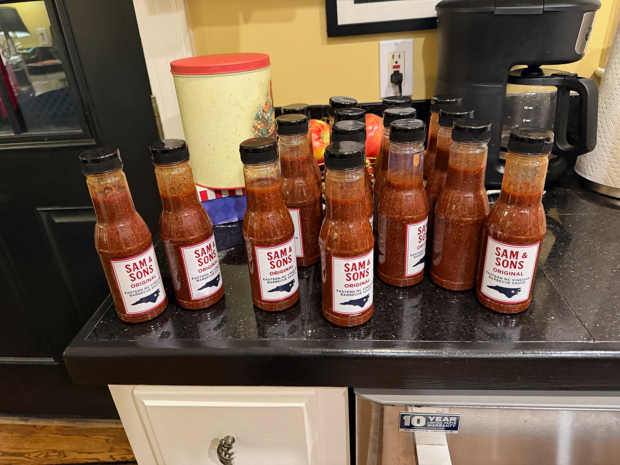 The first group of hand-filled Sam and Sons bottles on the kitchen counter