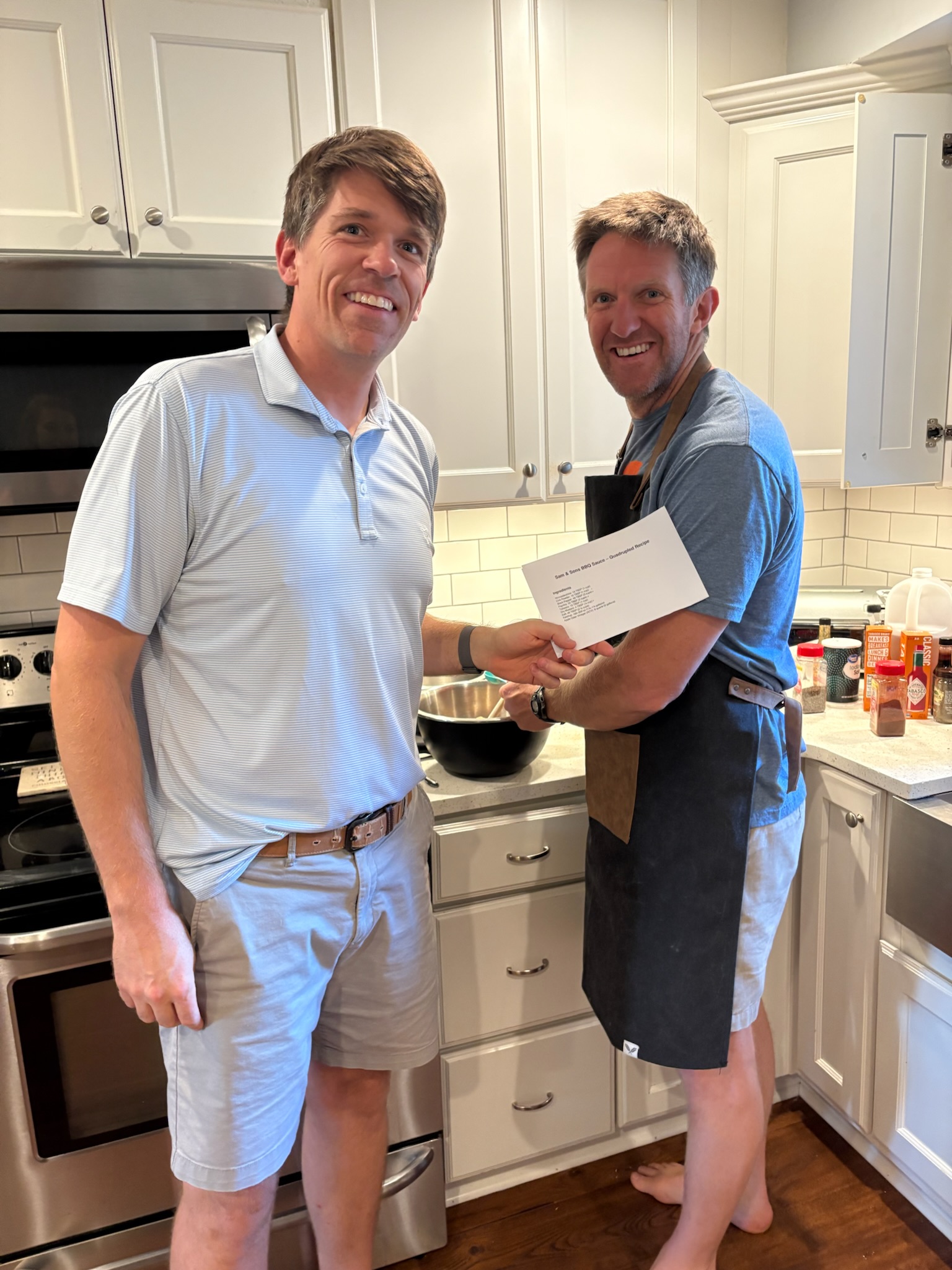 Sam’s sons making a batch of the family barbecue sauce in the kitchen