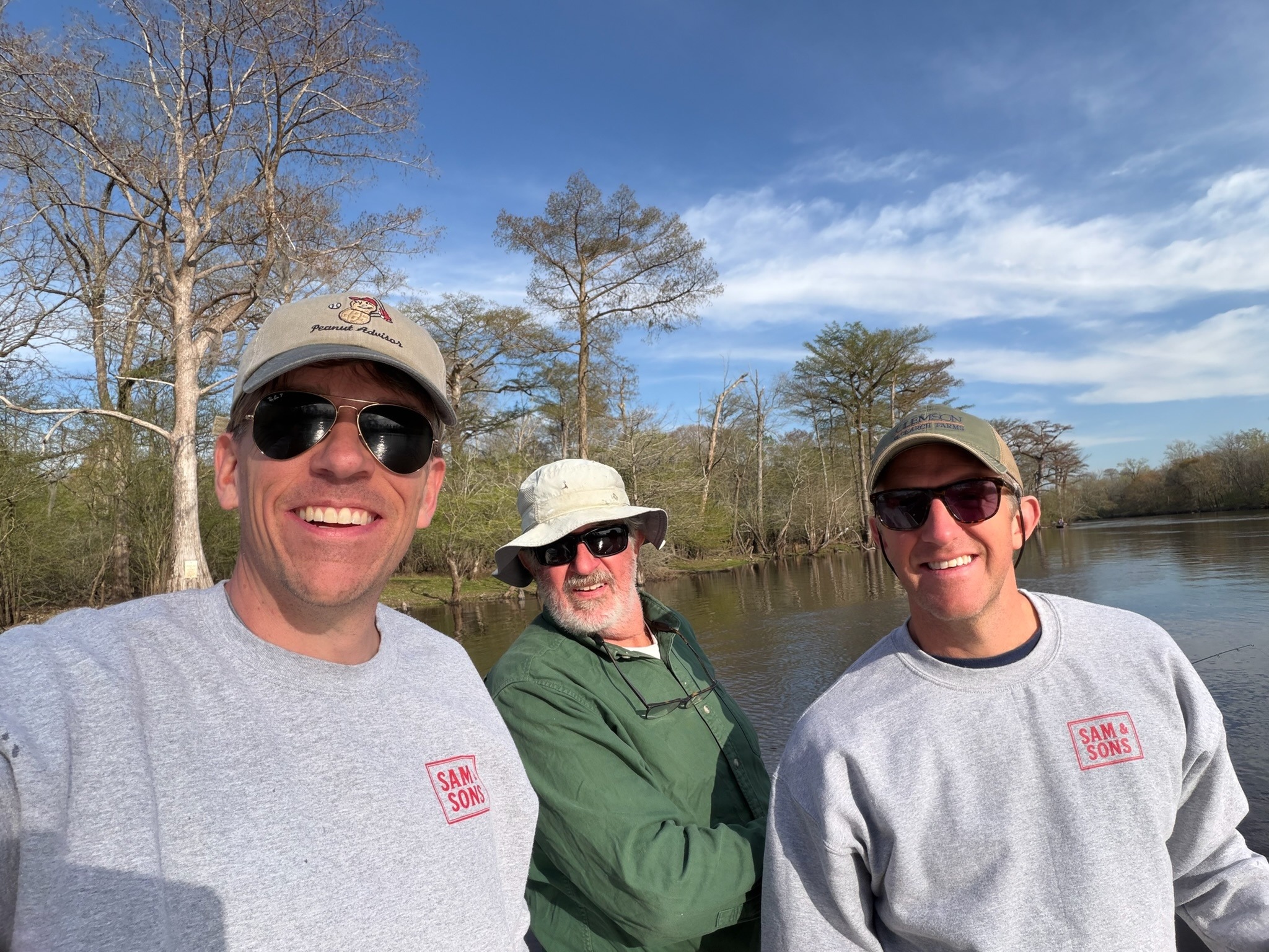 Sam and his two sons together by an Eastern North Carolina river